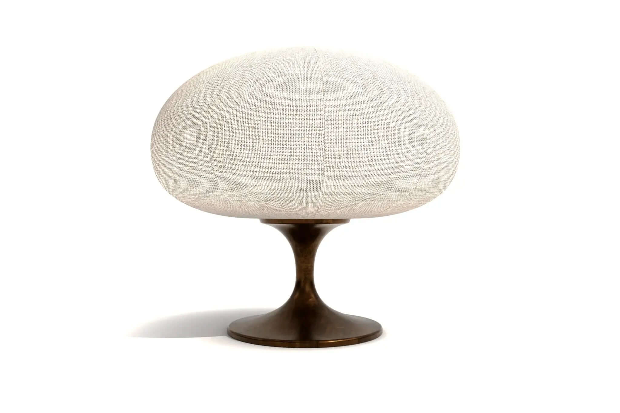 Modern table lamp with bronze base and cream fabric shade, sleek design for versatile decor.