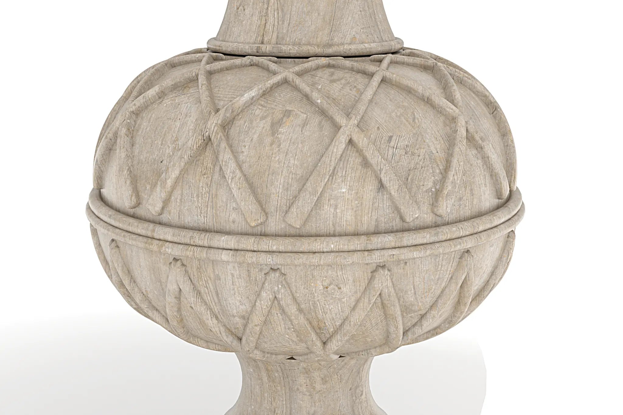 Kalmar Dining Table pedestal base with carved sphere and lattice pattern showcasing rustic design.